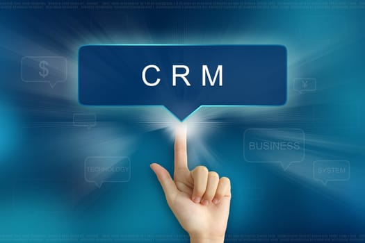 hand pushing on CRM or Customer relationship management balloon text button