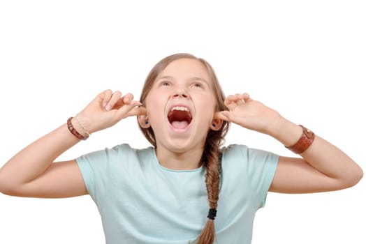 A young girl covers ears with hands on white background