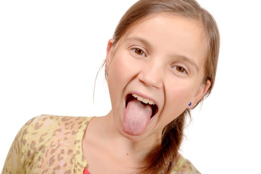 little girl puts out her tongue isolated on the white background