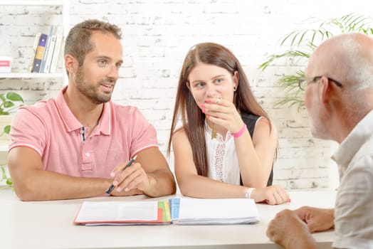 A young couple meeting architect for future house