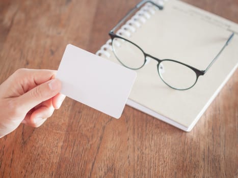 Woman hold blank business cards, stock photo