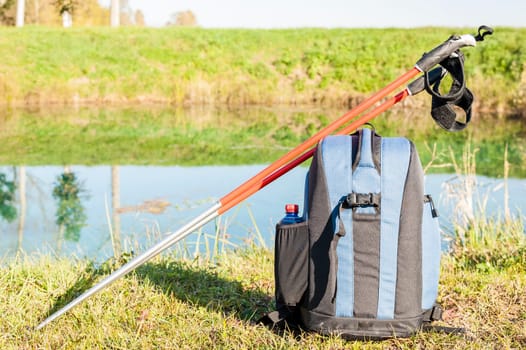 Backpack and sticks to do nordic walking on country roads.