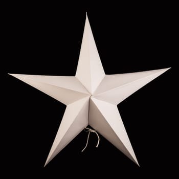White paper star on black background