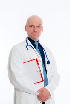 friendly young doctor with clipboard in front of white background