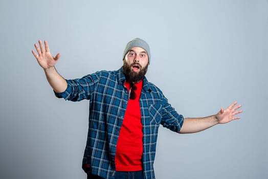 young bearded man lokking amazed in to the camera