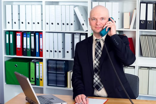 young businessman in the office is calling