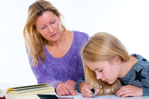 girl learning together with teacher in the classroom