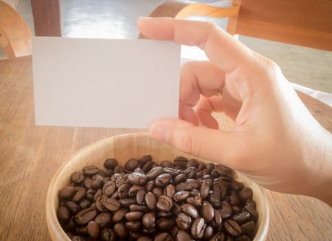 Roasted coffee bean and business card, stock photo