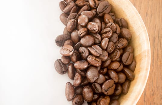 Roasted coffee bean in bowl, stock photo