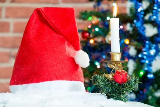 christmas decorations with a red cap and candle