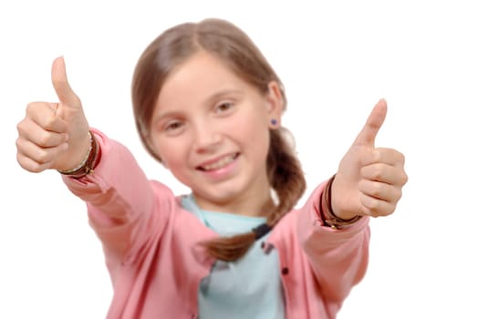 happy, smiling young little girl giving thumb up gesture, isolated on white