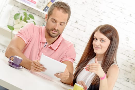 a young couple buying on internet with credit card