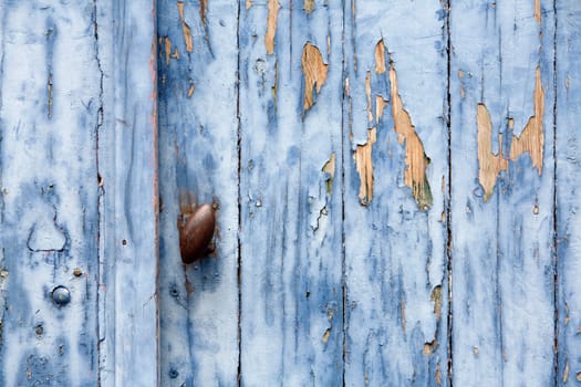 Blue peeling paint door background
