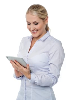 Young woman looking into tablet device