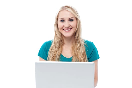 Pretty smiling woman using laptop