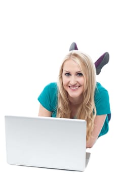 Smiling woman working on laptop