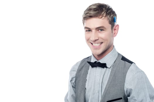 Young stylish guy posing over white