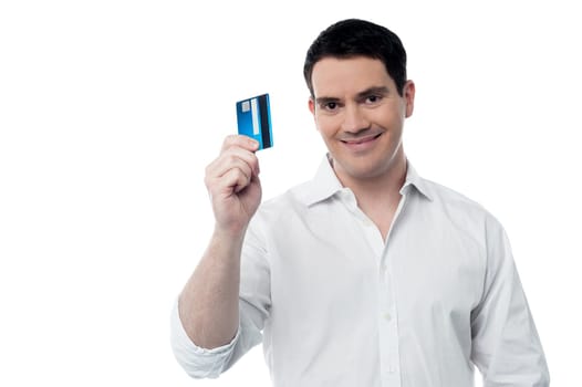 Handsome man showing credit card