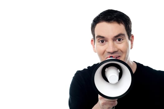 Caucasian man speaking through megaphone