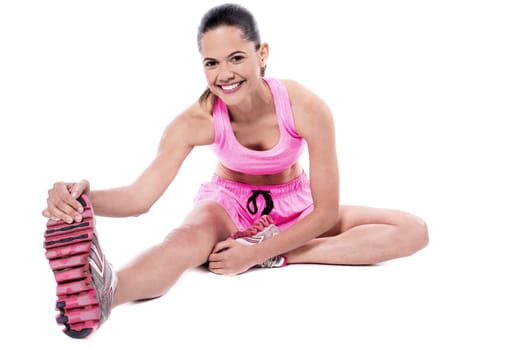 Young woman stretching her body parts