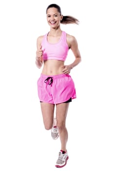 Young  female athlete in running posture
