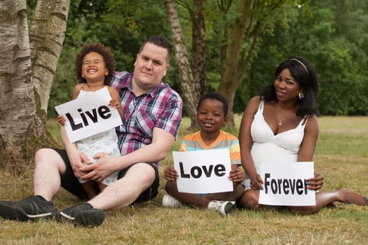 African multicultural family is holding white boards