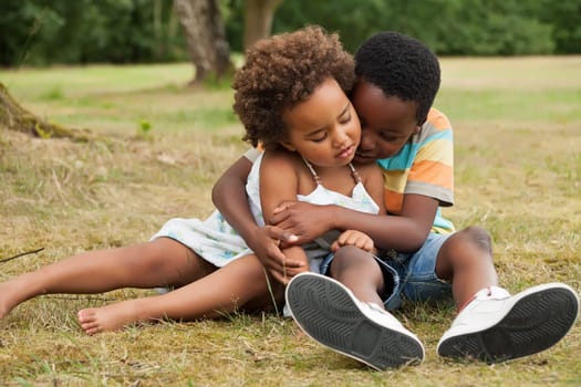 african brother and sister having fun in nature