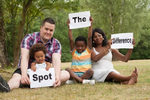 African multicultural family is holding white boards