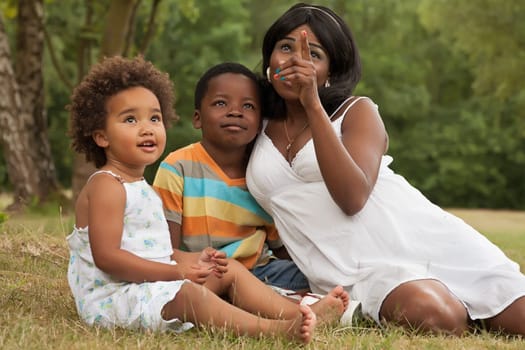 African mother and her kids are having fun in the nature