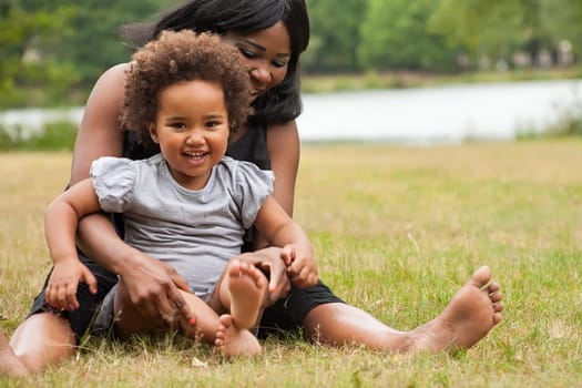Pregnant mother and her daughter are having fun