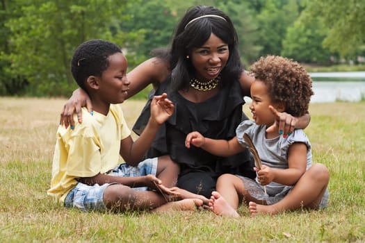 African mother and her kids are having fun in the nature