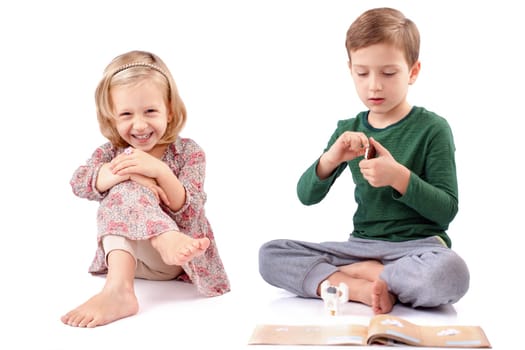 Boy and girl playing differently with different attitudes
