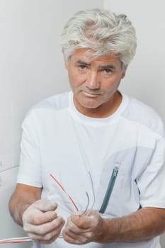 Electrician holding cables