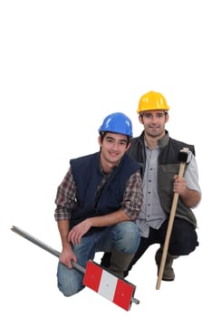 Tradesmen kneeling