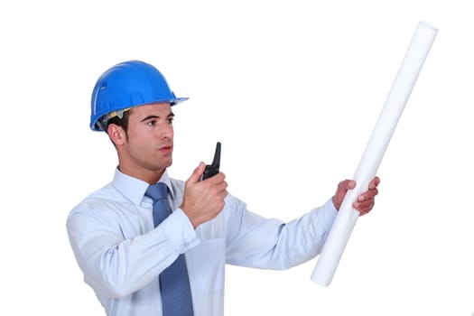 An architect giving instructions through a talkie.