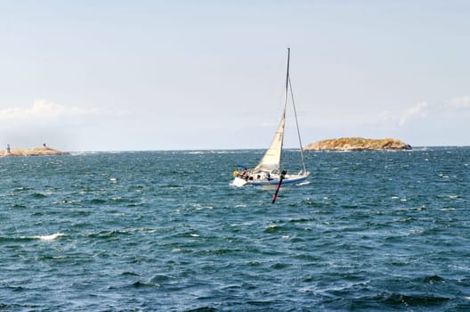 sailing a blowing day on westcoast in sweden one lonely boat