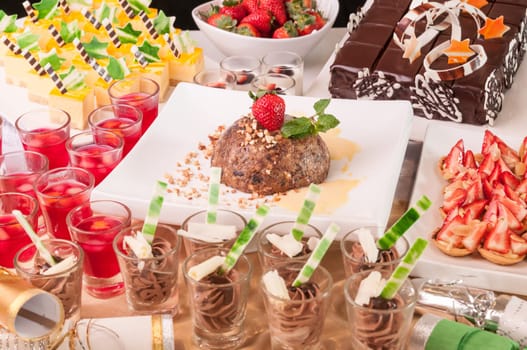 An array of Christmas desserts with bon bon on a table