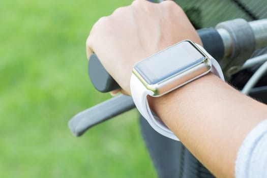 closeup hand wear smart watch riding bicycle exercise sport