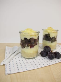Trifle with vanilla yoghurt,red grapes and biscuit crumbs