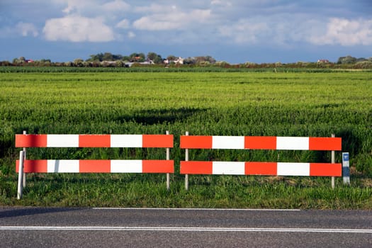 Barricade  between  country road and fields