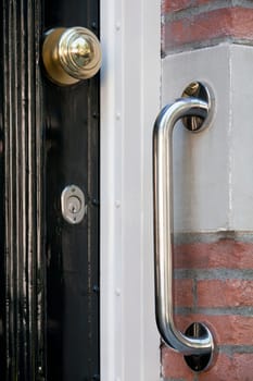 Safety grab handle near a door