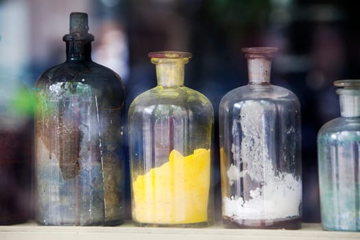 Coloring agent in bottles for giving color to the paint. Focus on the yellow bottle.