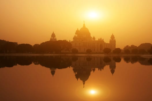 Sunset lake reflection Victoria Memorial in Kolkata or Calcutta, India.