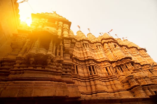 Ancient sandstone made Hindu Temple inside Golden fort of Jaisalmer, Rajasthan, India with beautiful sunlight.