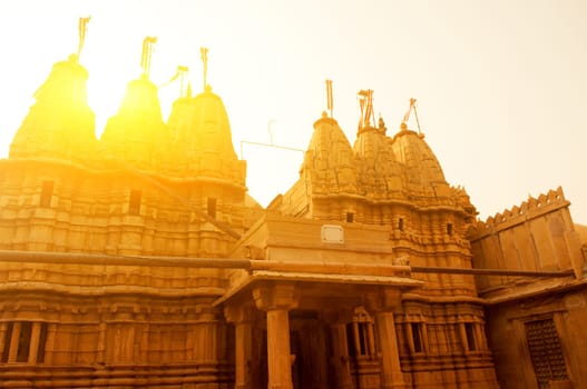 Ancient sandstone made Hindu Temple inside Golden fort of Jaisalmer, Rajasthan, India with beautiful sunset.