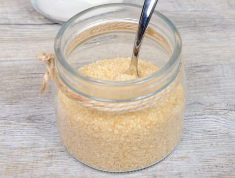 A glass jar filled with cane sugar