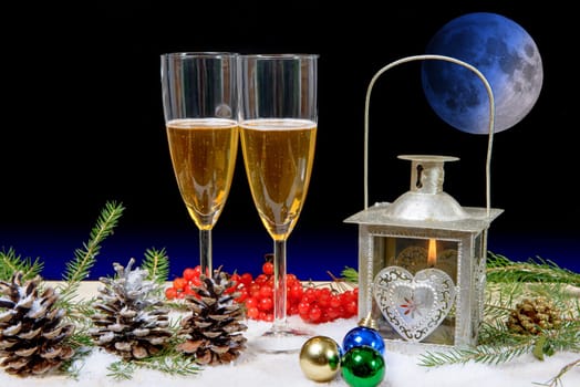 two glasses of champagne in a christmas decor, moon on background