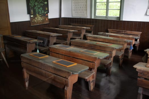 Old school benches in a classroom