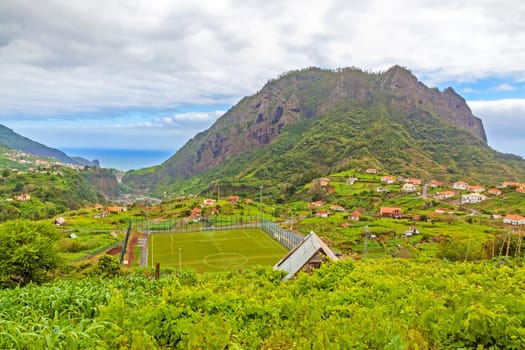 Town Porto da Cruz, Madeira with view to the Atlantic ocean and impressive eagle rock