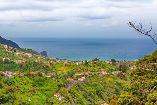 Madeira landscape near Faial and Porto da Cruz - view towards Atlantic Ocean over hills with houses